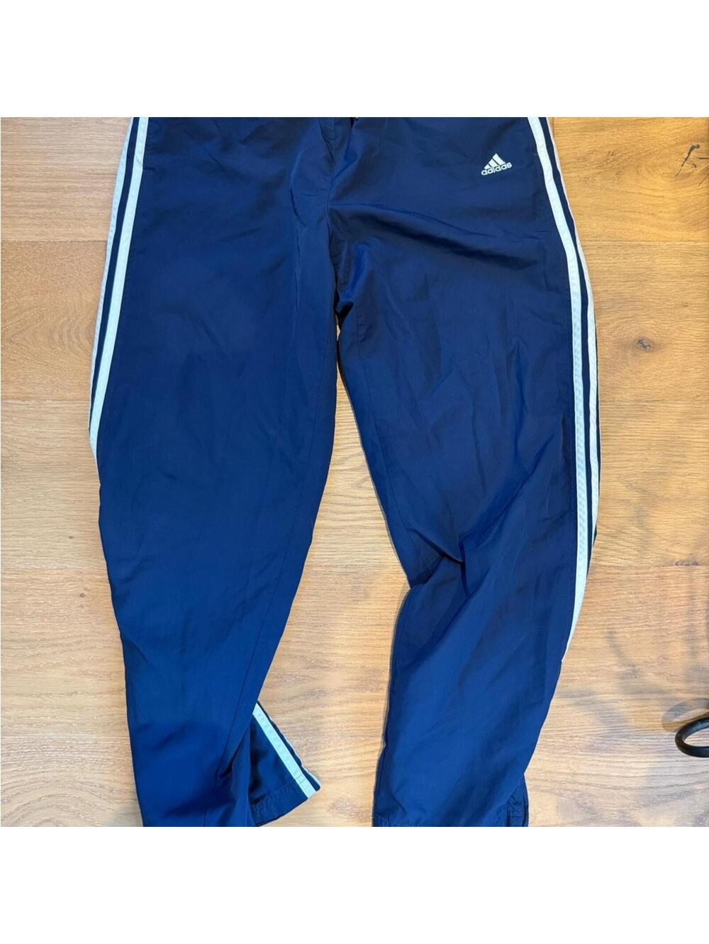 Adidas Blue Track Pants with Three-Stripe Design